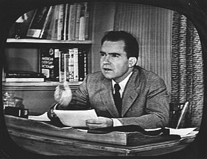 Richard Nixon seated at his studio-made office during his Sept 1952 “Checkers” speech.