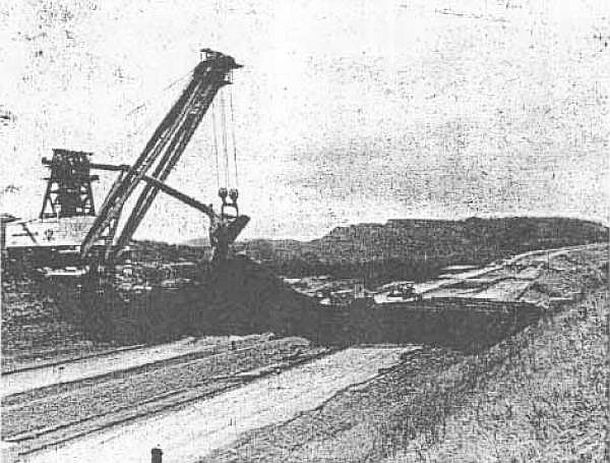 The Mountaineer shovel shown continuing to aid in the construction of the land bridge upon which it and another shovel, The Tiger, would cross interstate highway I-70 in Ohio in order to strip mine coal fields on the other side.