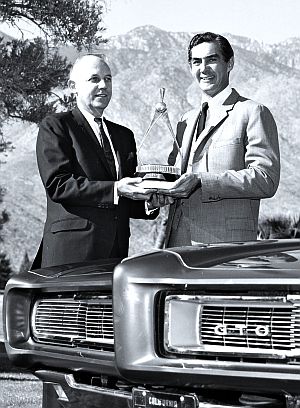 1960s: John DeLorean receiving a Motor Trend award for his work on the Pontiac GTO.