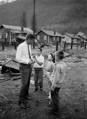 Kennedy talking with children as he campaigned in West Virginia for the state's May 1960 primary.