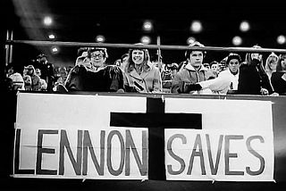 Some Beatles fans inside Candlestick Park offered home-made signs of cheeky support for John Lennon, like this one.