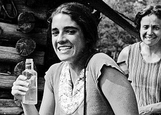 July 1973. Caroline’s friend, Allyson Riclitis, about to sample some local moonshine as Marie Cirillo looks on. Photo, C. Kennedy.