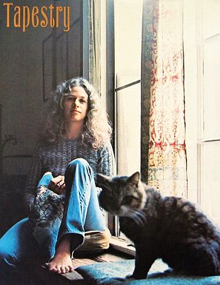 A portion of the cover art from Carole King's 1971 album, 'Tapestry," with Carole & cat in view. Click for Amazon link.