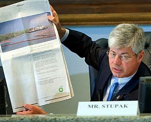 June 7, 2010. During Congressional hearing in Chalmette, LA, Rep. Bart Stupak (D-MI) holds up full-page BP newspaper ad to illustrate  complaint about BP paying for advertising while Gulf Coast region faced financial need.