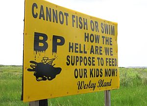 Signs of protest – like this one along a Grand Isle, LA highway in July 2010 – were spotted throughout the region, expressing anger of those whose lives and livelihoods were turned upside down by the spill, fishing restrictions, and oil drilling bans.