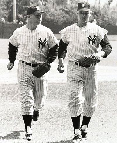 Mickey Mantle and Roger Maris jogging in from the outfield, circa 1960s.  Mantle played center field, Maris played right field.