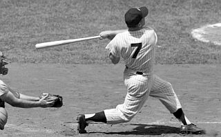 Mickey Mantle, a switch-hitter, showing his power from the right side of the plate, capable of 'distant shot' home runs of 500 feet or more.