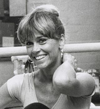 1979: Jane Fonda, with ballet exercise bar behind her.