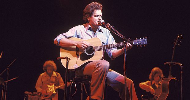 Harry Chapin performing, here with other backing musicians, but sometimes on tour, he performed solo.