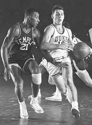 Dick Groat of Duke University driving for the bucket during his collegiate career in a game against Temple.