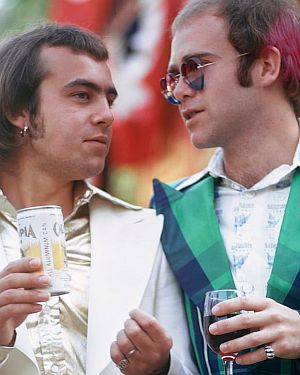 July 10, 1973.  Bernie Taupin and Elton John enjoying their early success at a private Universal Studios party, Universal City, California.