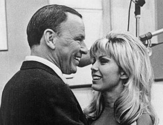 1967. Frank Sinatra with daughter Nancy in recording studio.