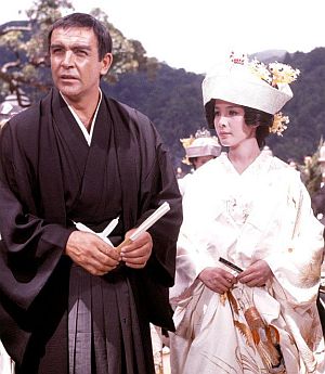 James Bond, in staged  marriage ceremony to Kissy Suzuki in Japanese fishing village, as part of his cover. Click for song.