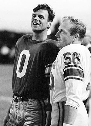 After his shot at QB, Plimpton talks with Joe Schmidt, No. 56, the linebacker who opposed him during his series of downs. Sports Illustrated photo.