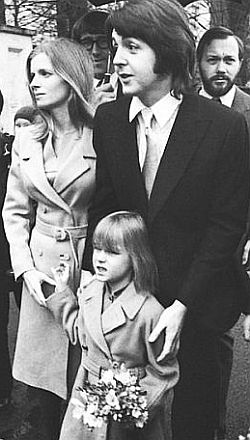 March 1969. Linda & Paul McCartney at their wedding, with daughter/flower girl Heather.