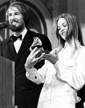 March 1967. John and Michelle Phillips accepting Grammy Award for 1966 Mamas & Papas hit song, "Monday, Monday".