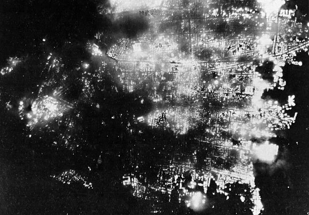 August 1, 1945. Nighttime aerial view of fiery scene below as much of Toyama, Japan, a city of 100,000 and a large producer of aluminum, burns to the ground after 173 American B-29 bombers dropped incendiary bombs on the city.