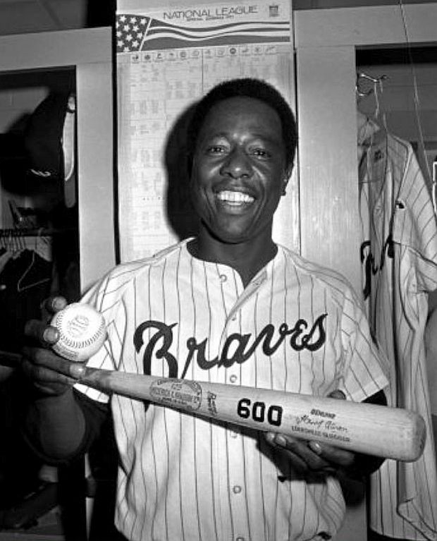 April 1971. A pleased Hank Aaron holds bat & ball for his 600th major league home run – a high fly of 350 feet that landed on the stadium wall behind the left field fence at Atlanta’s stadium.  AP photo / JS. 