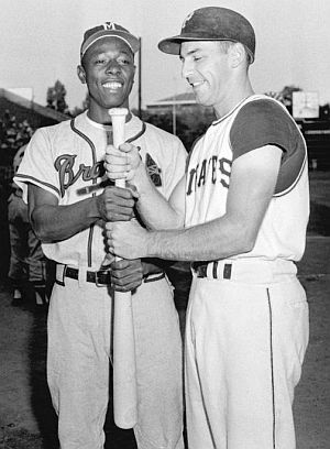 Henry Aaron and Dick Groat of Pittsburgh Pirates were among those vying for 1957 batting title. Stan Musial won it at.344, Aaron finished at .322 and Groat at .315. Click for Groat’s story.