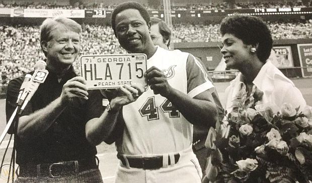 As part of festivities honoring Henry Aaron for his career home run record ( here with his wife Billye),  Georgia Governor Jimmy Carter  presented him with a personalized Georgia license plate that read: "HLA-715," referring to Aaron’s  initials  – “Henry Louis Aaron” – and the record-breaking home run, No. 715. 