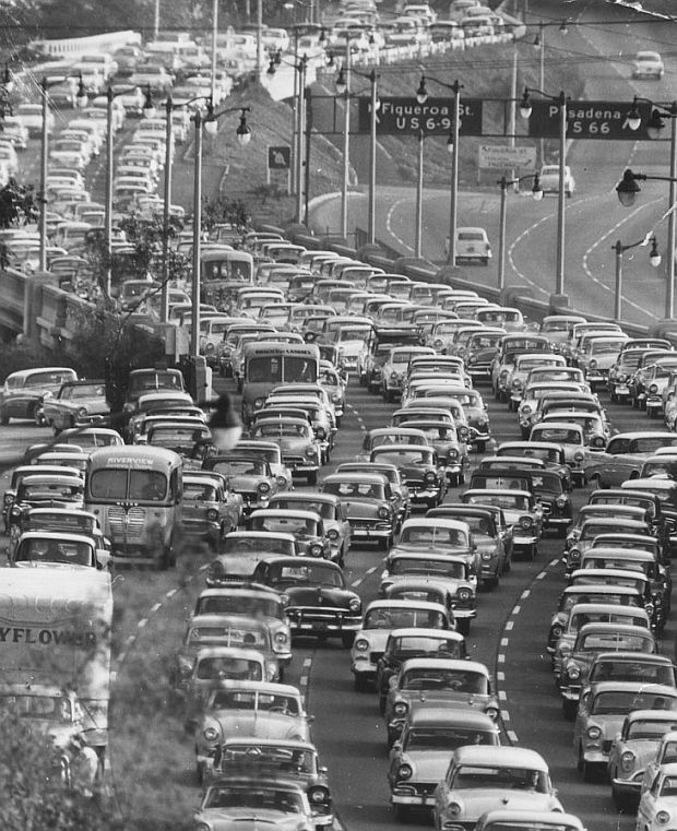 1956. Traffic on the Pasadena Freeway, which connects L.A. with Pasadena, captures the growing population of motor vehicles then in the L.A. region, where “vehicle miles of travel” for its then 2 million-plus vehicles, was exceeding 50 million miles every day.