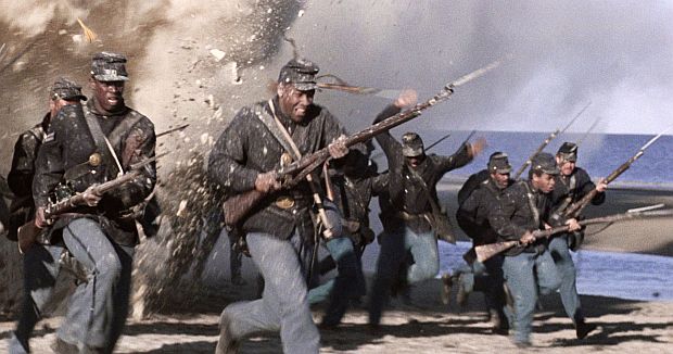 Scene from “Glory” showing early charge of the Massachusetts 54th amid exploding shells as they make their way along the beach for their assault on the heavily fortified Ft. Wagner. Here, Thomas and Trip are shown at left.