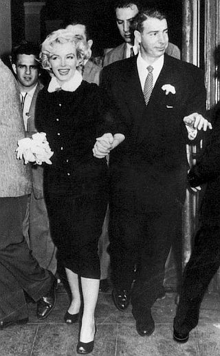 Marilyn Monroe and Joe DiMaggio emerging from their civil ceremony marriage in San Francisco, January 14, 1954.