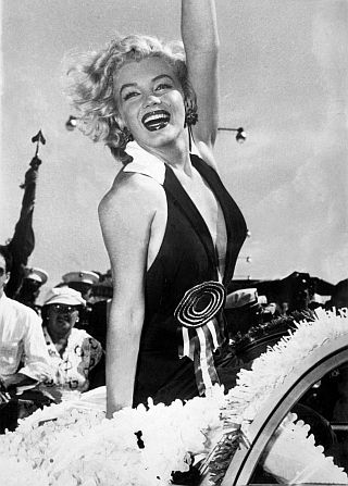 September 1952. Marilyn Monroe in v-cut-to-the navel dress at Miss America Pageant parade in Atlantic City, NJ.