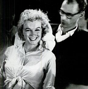 Monroe being toweled off by Arthur Miller on “Let’s Make Love” film set after 6-hr dance rehearsal. Life. 