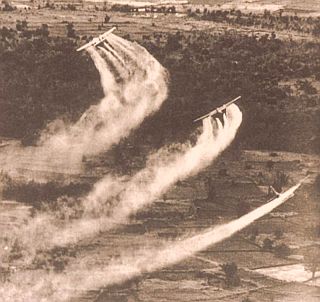 1962. Herbicidal defoliants being sprayed by U.S. military in Vietnam via “Operation Ranch Hand.” AP photo. 