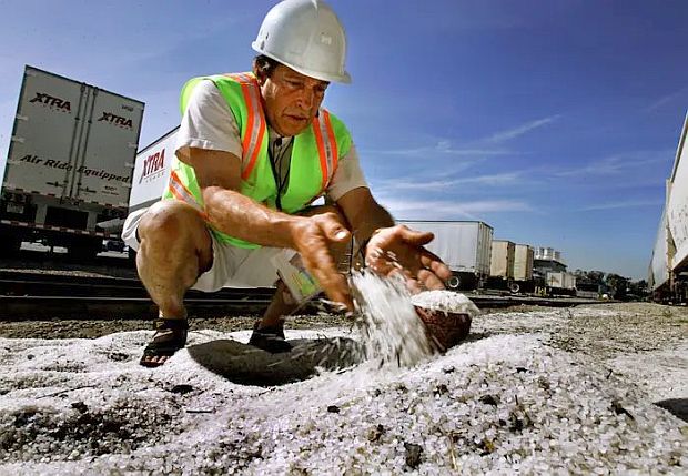 2005 photo of Charles Moore, founder of the Algalita Marine Research Foundation, and working to stop nurdle spills, is shown here with nurdles on the ground at a railroad /trans shipment area near a plastics manufacturing plant in the town of Vernon, CA, south of Los Angeles. Moore is also author of the 2011 book, “Plastic Ocean”. Photo, Rick Loomis / Los Angeles Times.
