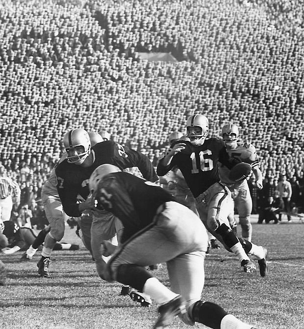 Army QB, Rollie Stichweh (No. 16), on one of his runs in the fourth quarter, leading to a touchdown and later 2-point conversion bringing Army to within one score of tying Navy with minutes to go.