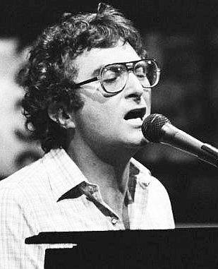 A younger Randy Newman at the piano, circa 1970s.