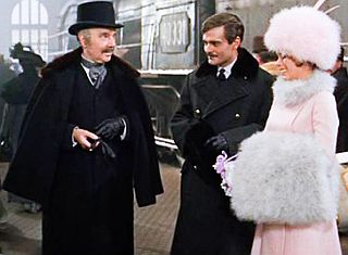 The Gromekos and Zhivago greet Tonya who has arrived in Moscow by train from Paris.