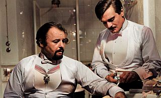 As Zhivago is dressing Komarovsky’s arm wound, the two have a somewhat testy exchange about Lara.