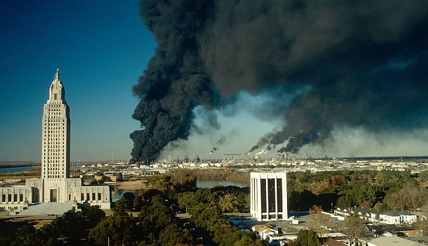 Dec 25th 1989: Exxon oil refinery in Baton Rouge, Louisiana, still smoking from a major Christmas Eve refinery explosion & fire that killed 2 and injured three, and caused property damage miles away. Photo, Sam Kittner.